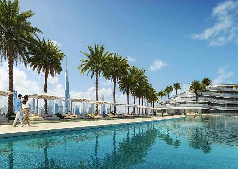 Binghatti Aquarise: Shared swimming pool lined with palm trees; official developer rendering