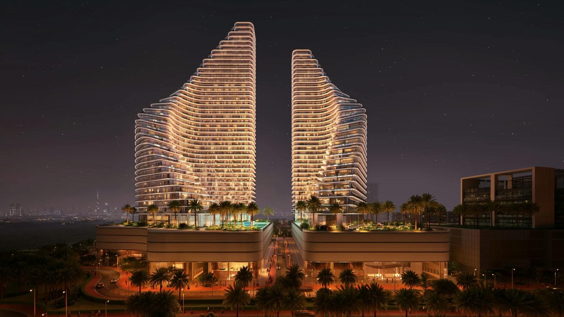 Binghatti Flare: Frontal view of both Flare towers at night; official developer rendering