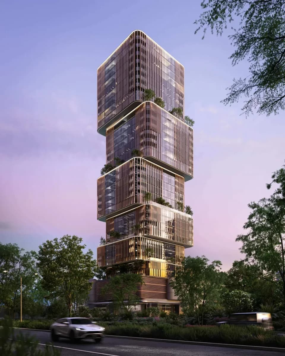 31 Above: Office tower with stepped volumes at dusk; official developer rendering