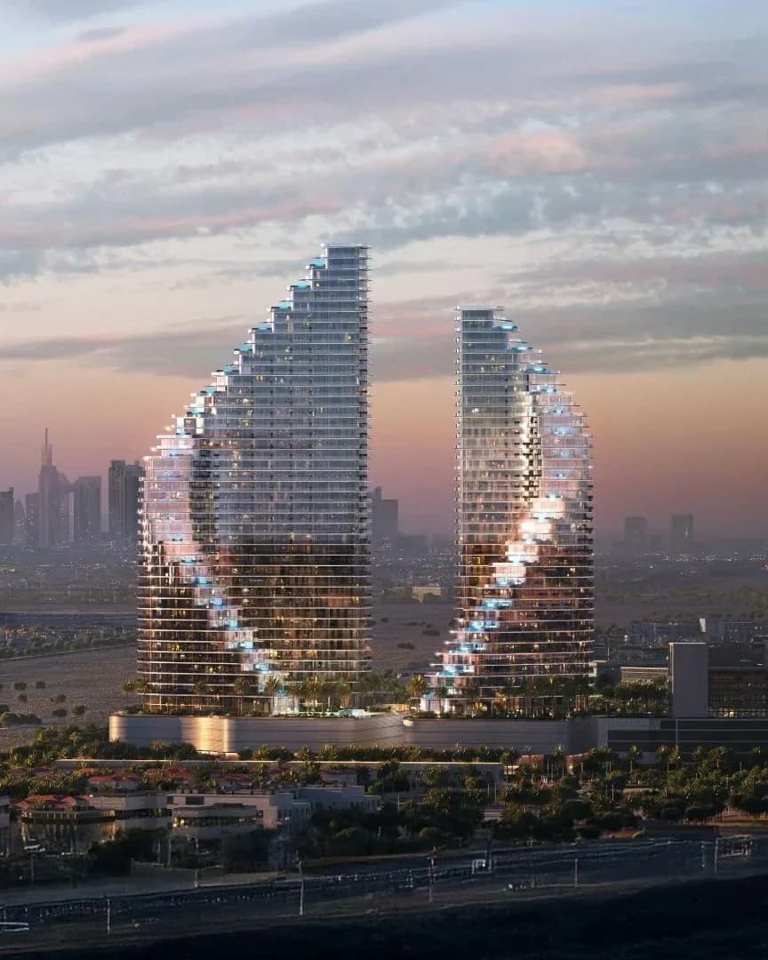 Binghatti Flare: Two sculptural residential towers at dusk; official developer rendering