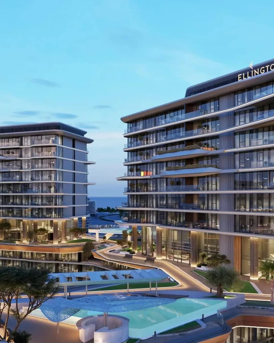 Costa Mare: residential buildings and a landscaped pool terrace at dusk — rendering