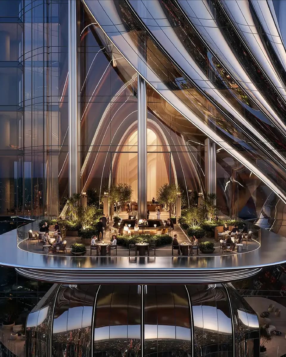 Lumena Alta: curved tower facade with a planted outdoor terrace at night — rendering