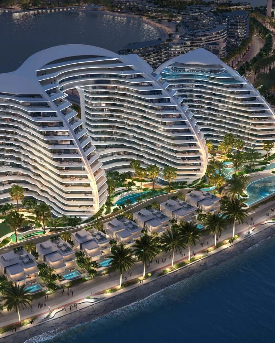 Oystra: aerial view of curved residential buildings beside the waterfront — rendering