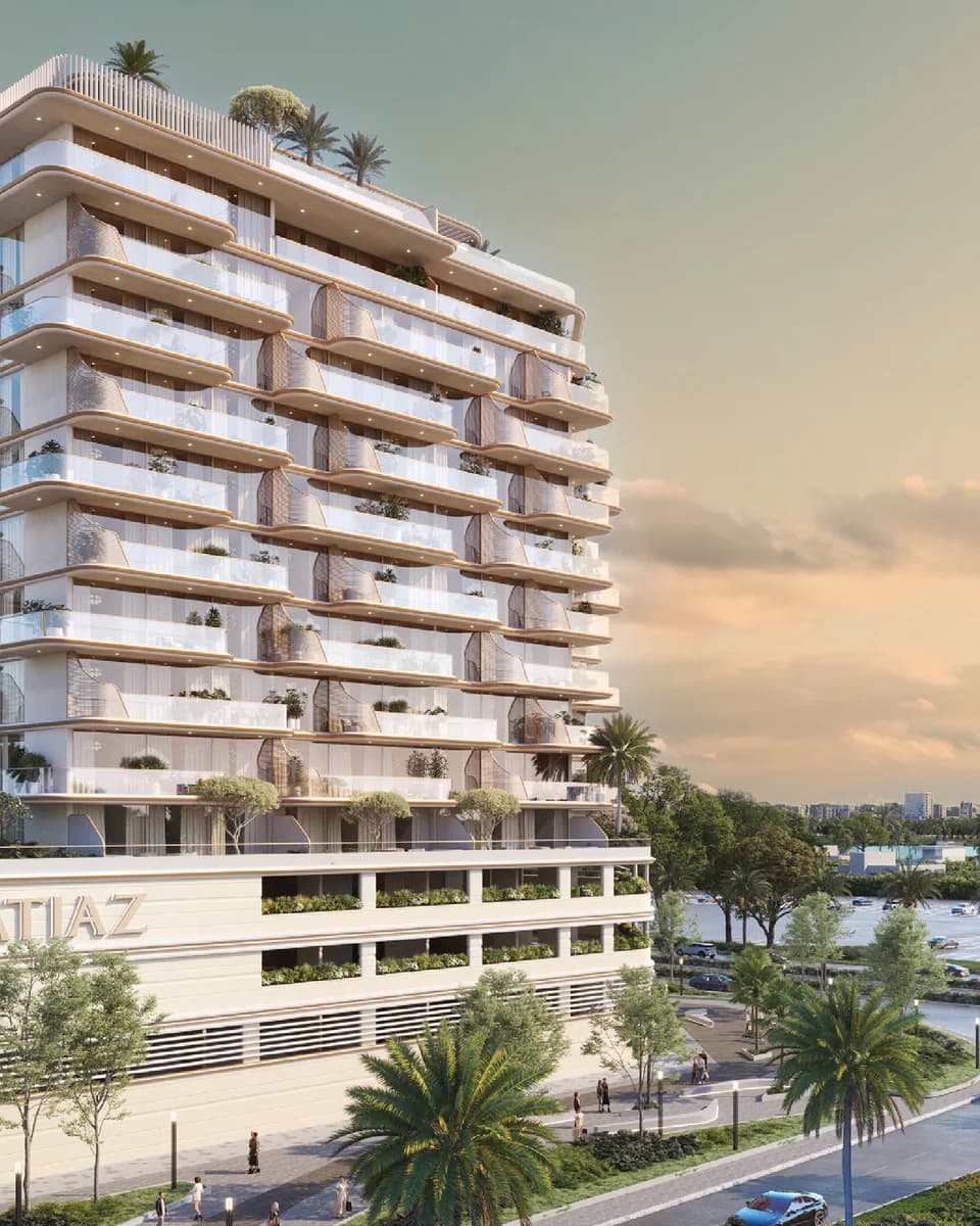 Sunset Bay Grand: residential building with stepped balconies at sunset — rendering