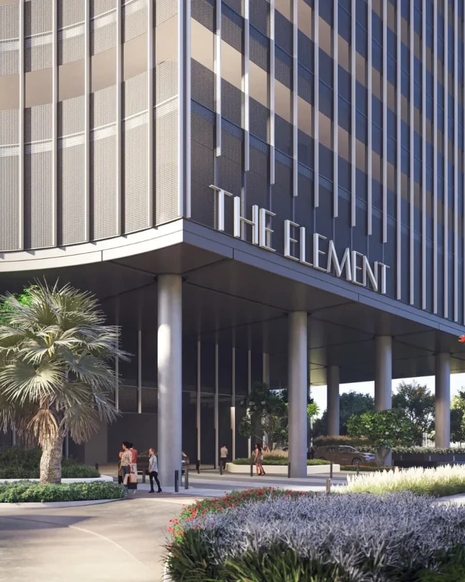 Landscaped arrival court beneath The Element entrance signage; official developer rendering