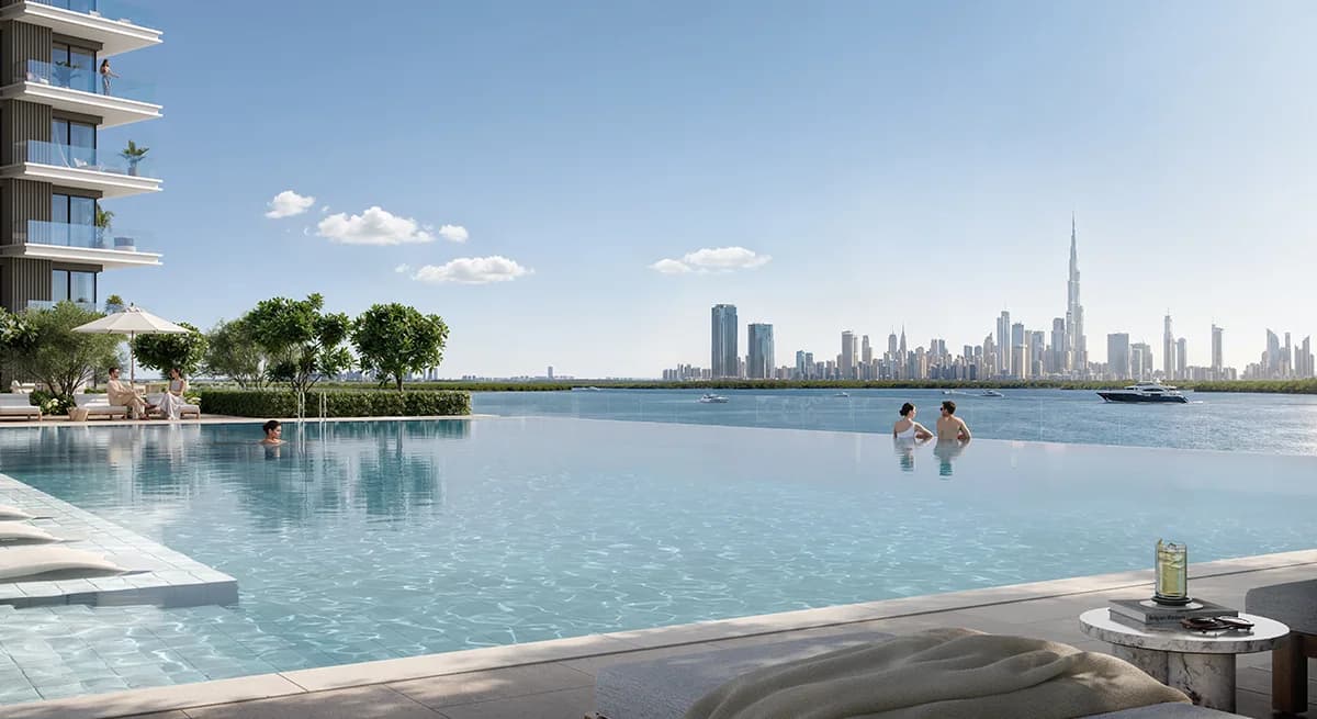 Creek Bay: infinity-edge pool facing the dubai skyline (developer rendering)
