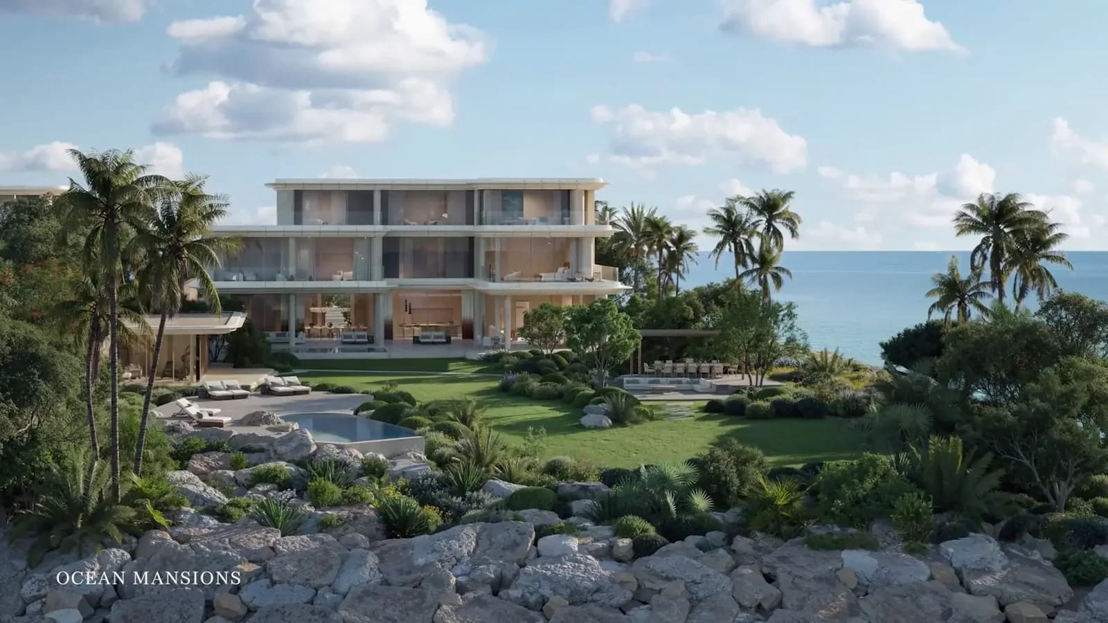 Jumeirah Asora Bay developer rendering: ocean Mansion exterior beside landscaped coastal grounds