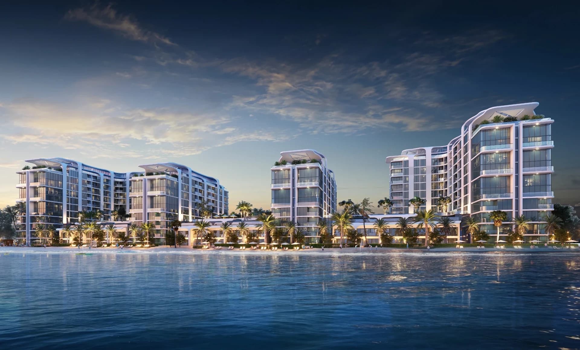Coastline Beach Residences: Coastal buildings at dusk (Developer rendering)
