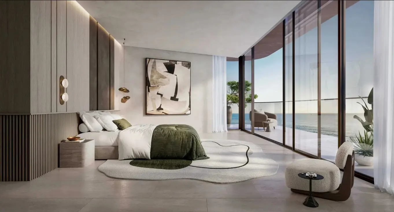 Soulever bedroom with curved glazing, terrace and sea view; official developer rendering