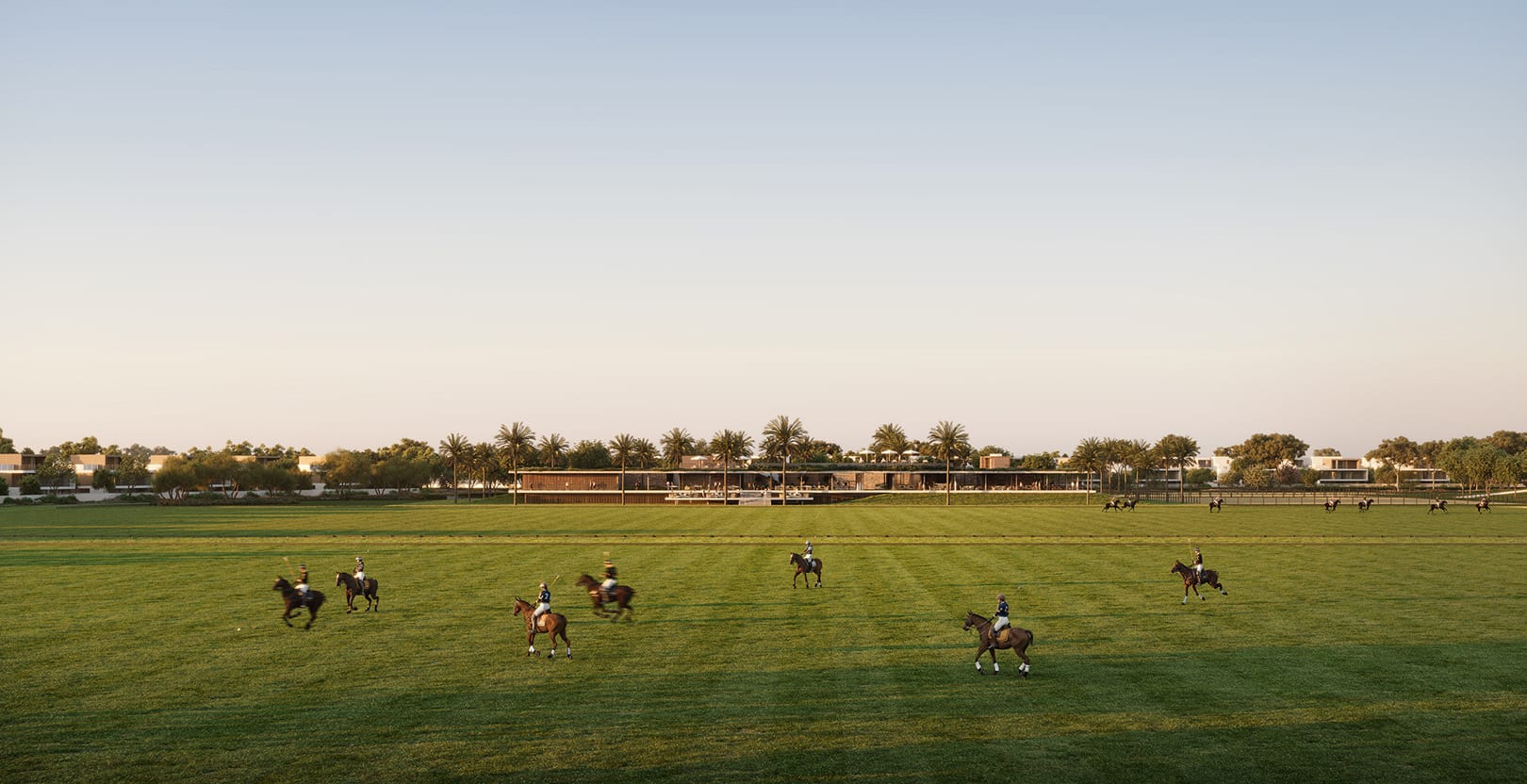Selvara 4 community polo fields with riders at sunset