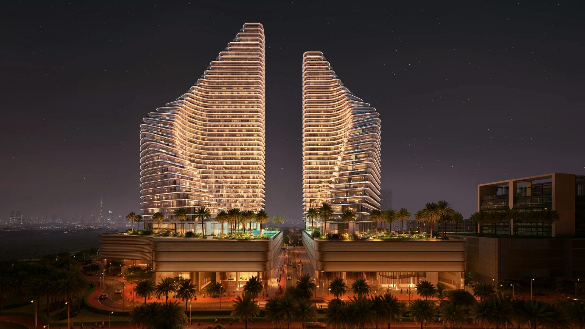 Binghatti Flare: Frontal view of both Flare towers at night; official developer rendering