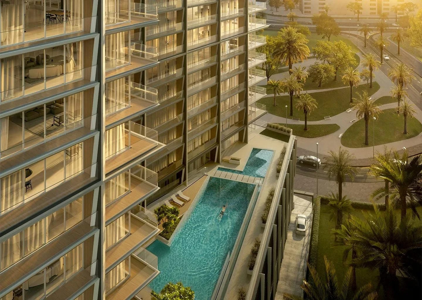Binghatti Starlight: Pool beside residential balconies and landscaping (developer rendering)
