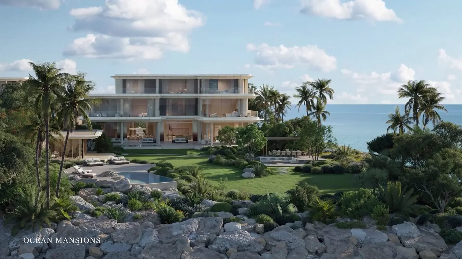 Jumeirah Asora Bay developer rendering: ocean Mansion exterior beside landscaped coastal grounds
