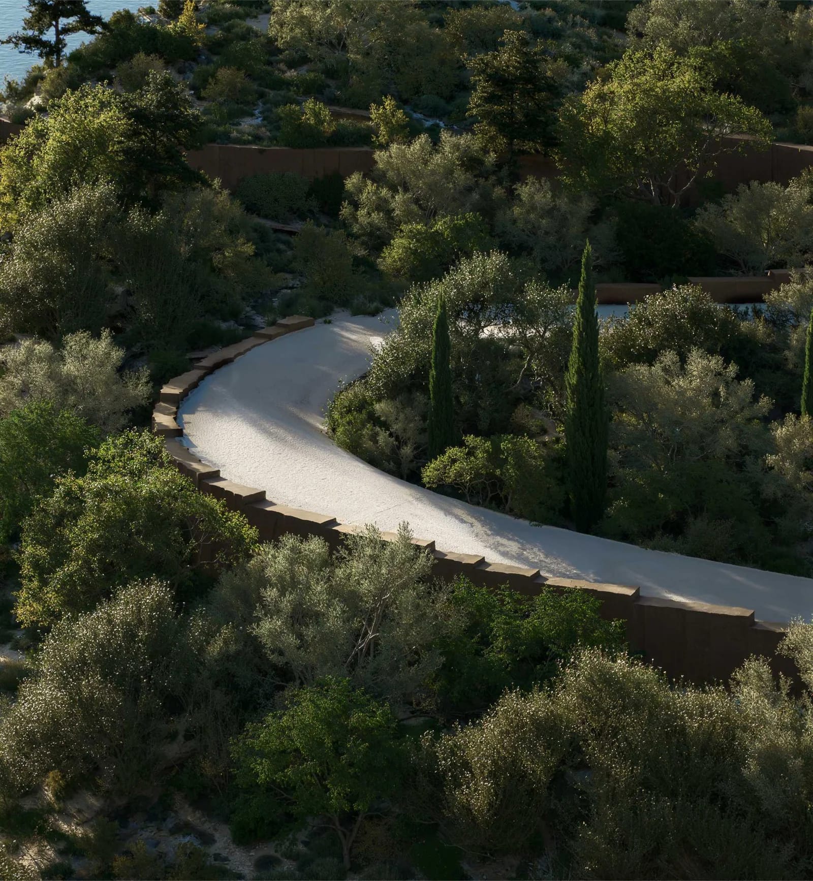 Jumeirah Asora Bay developer rendering: winding access road through the landscaped hillside