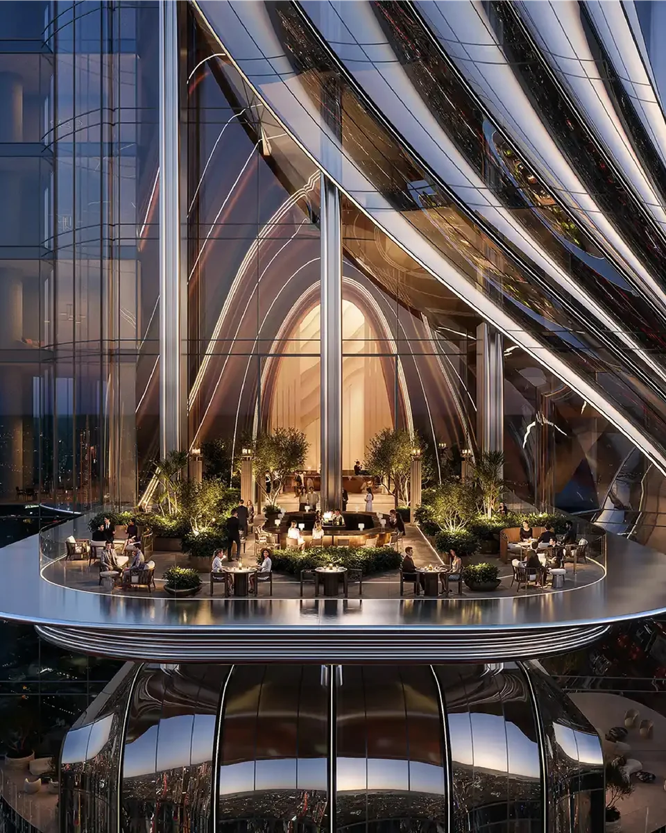 Lumena Alta: curved tower facade with a planted outdoor terrace at night — rendering
