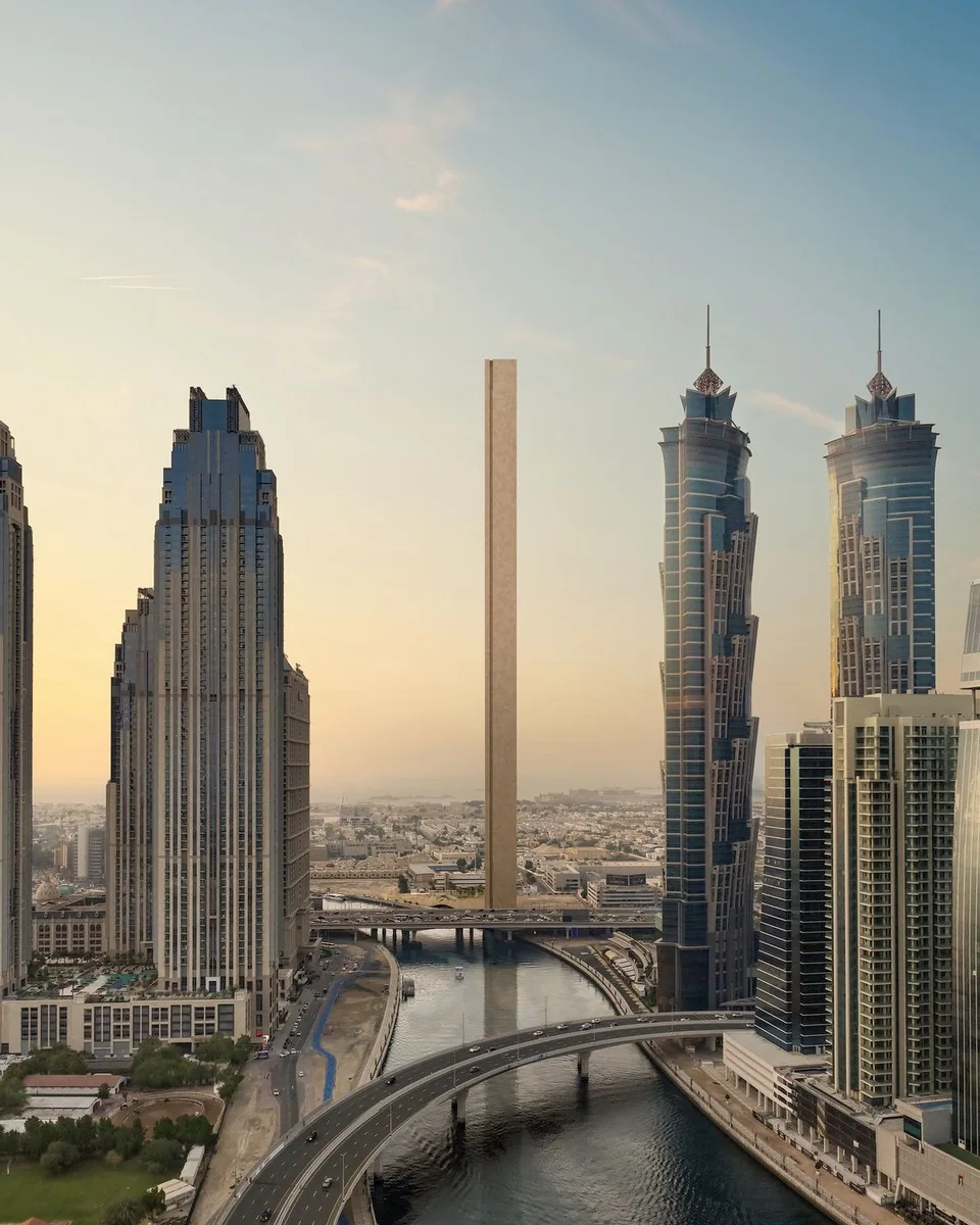 Muraba Veil: slender tower framed by nearby high-rise buildings — rendering