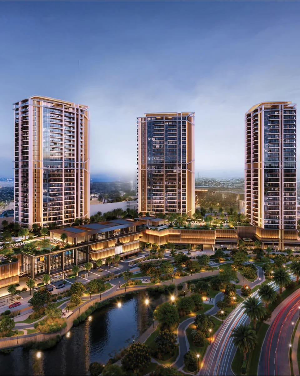 Eltiera Views: four towers around landscaped lakes at dusk — rendering