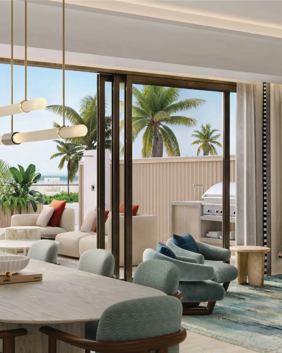 Fairmont Residences Al Marjan Island: living and dining room opening onto a palm-lined terrace — rendering
