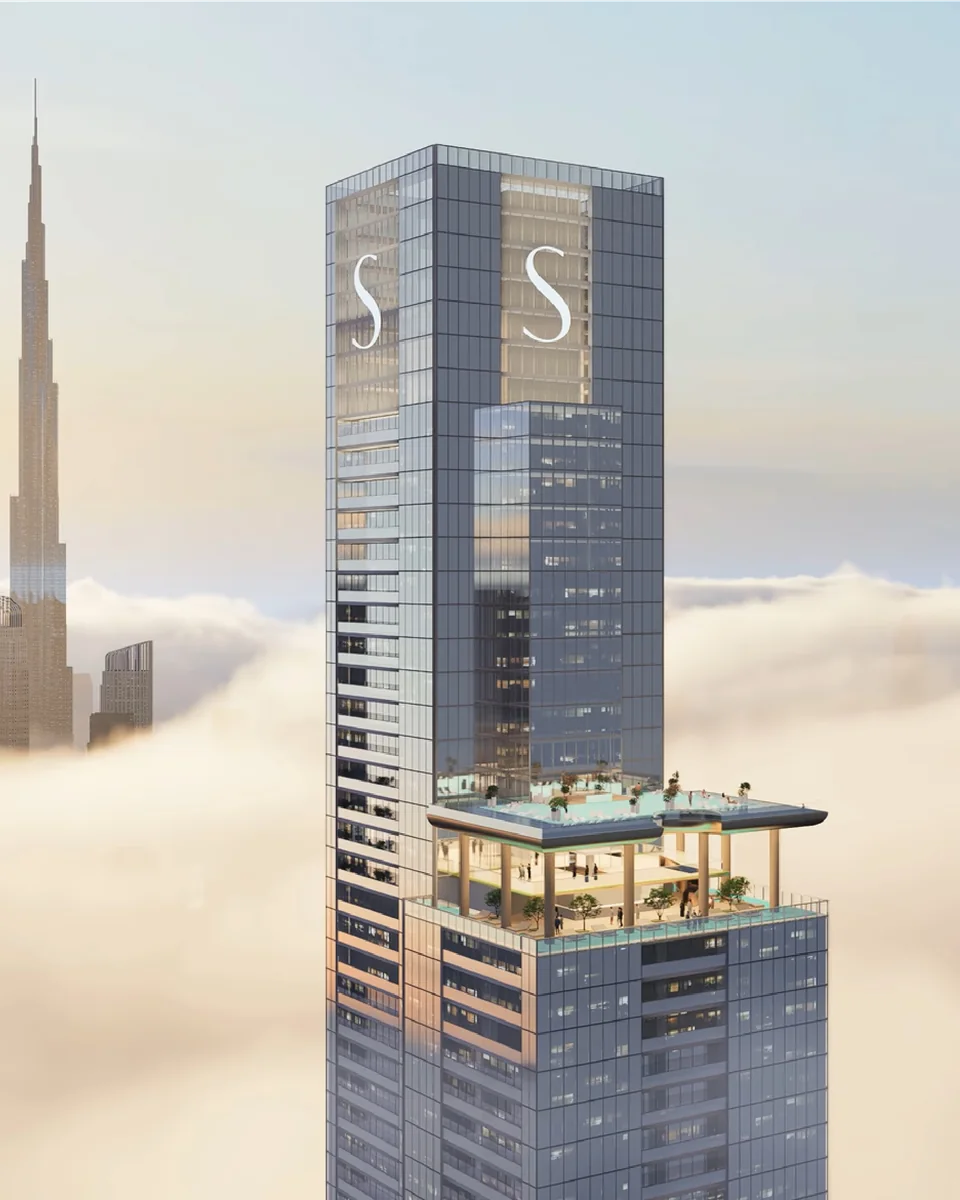 Sobha SkyParks: tall residential tower rising above clouds — rendering