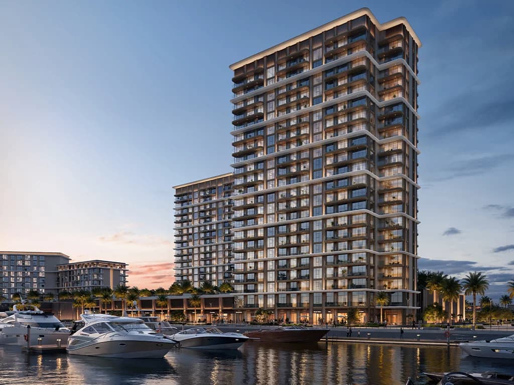 Baystar by Vida: residential tower beside the marina at dusk (developer rendering)