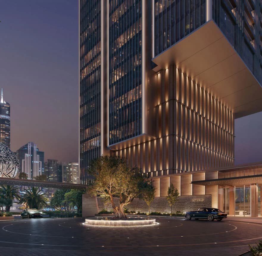 Jumeirah Residences Emirates Towers: Tower entrance and landscaped arrival court at dusk; official developer rendering
