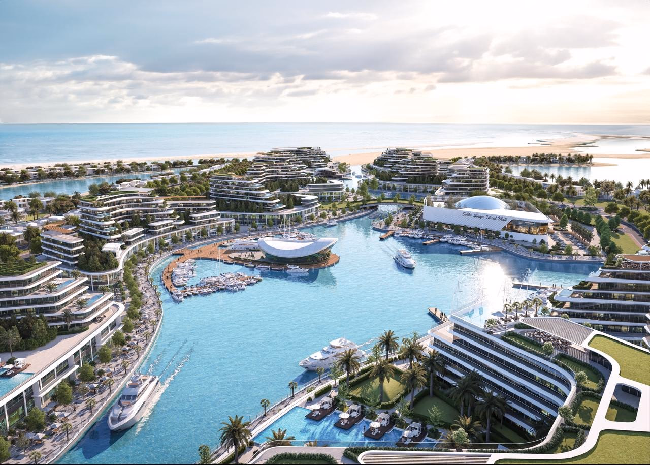 Starline Beach Residences: aerial masterplan view of the island, waterways and coastline — rendering